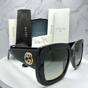 Gucci Glossy Black Sunglasses with Gold Emblem